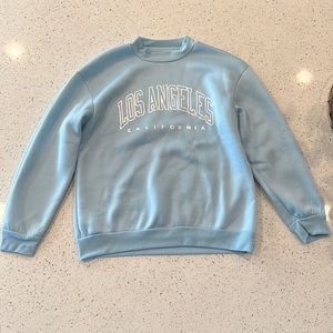 Shien woman’s LOS ANGELES CALIFORNIA baby blue sweat shirt size M